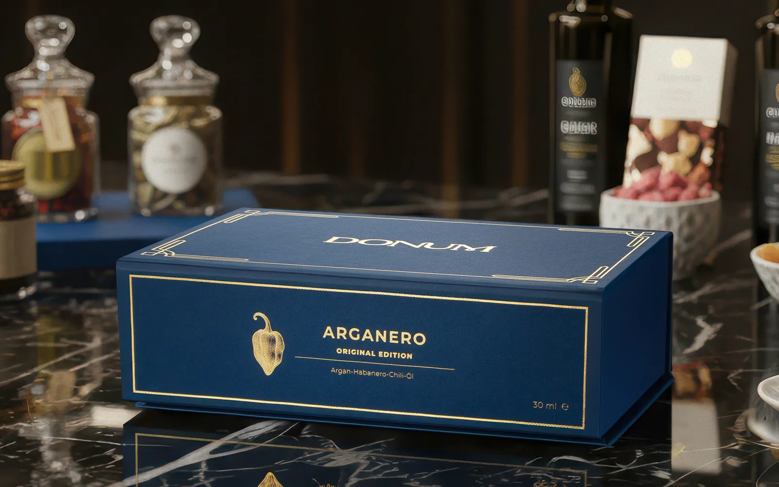 The DONUM gift box on black marble in a fine food setting
